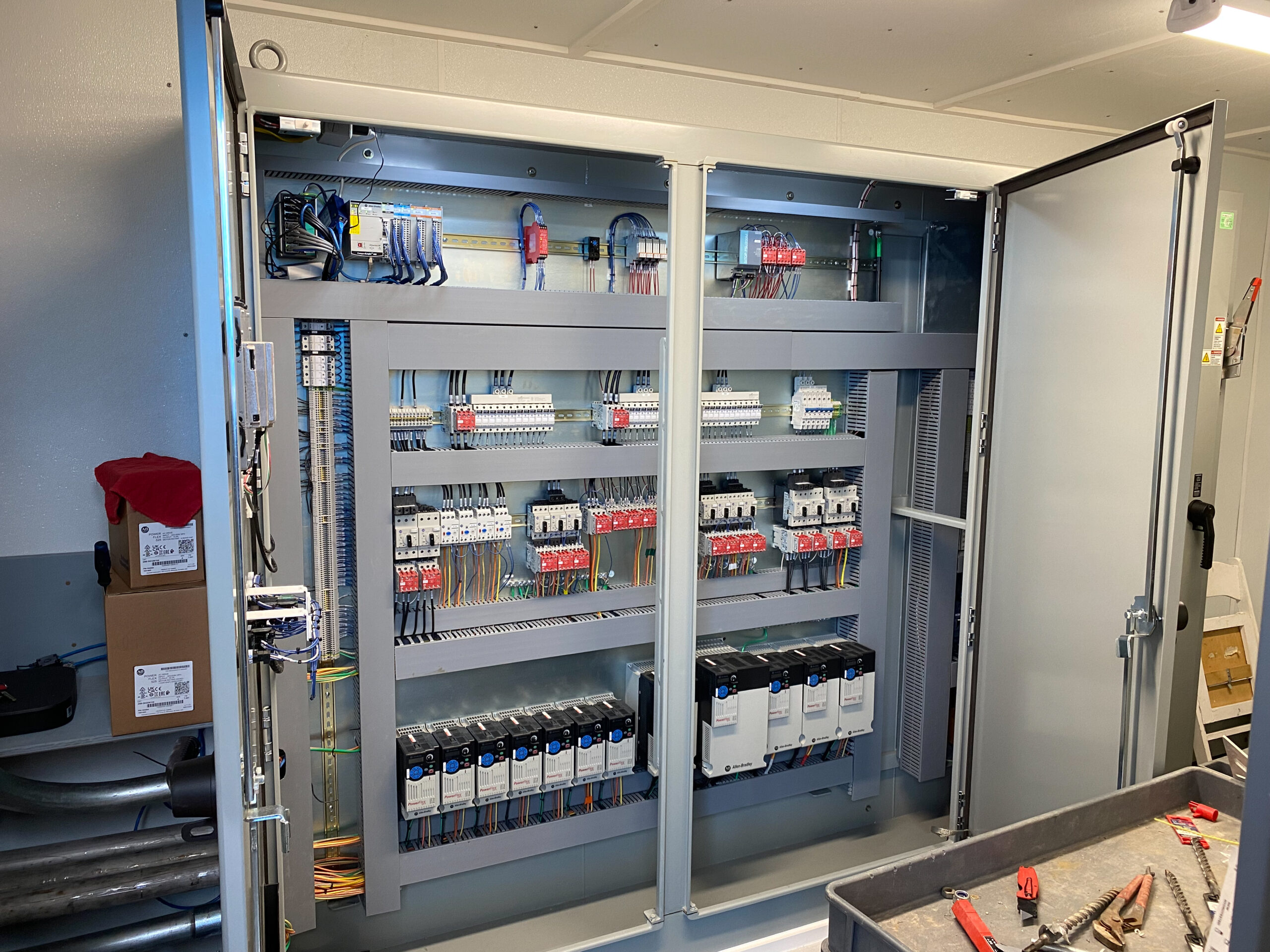 PLC control panel installed in the electrical room at The United Group